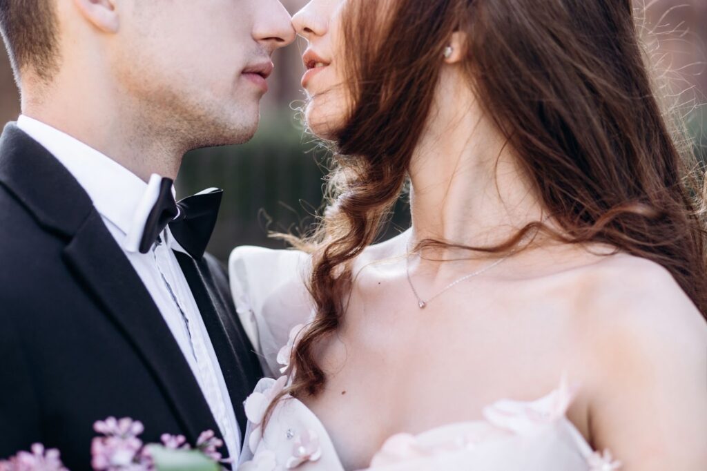 Close up of bride and groom kissing