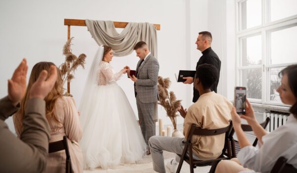 Bride and groom exchanging rings at the wedding ceremony