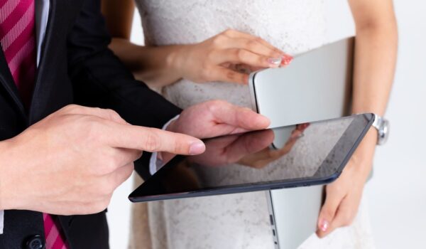 Close up of man and woman use tablet to presented project