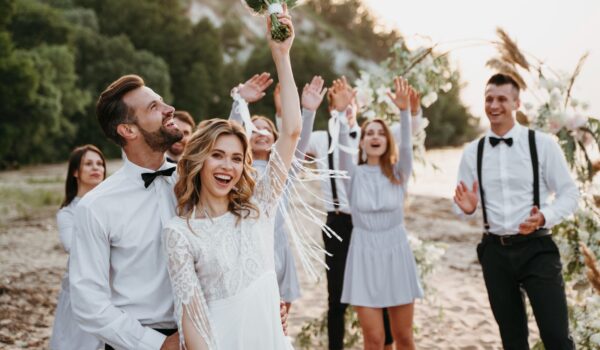 Bride at home is going to a wedding and holding her wedding dress