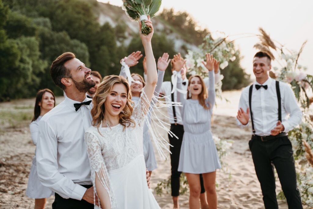 People celebrating a wedding on the beach