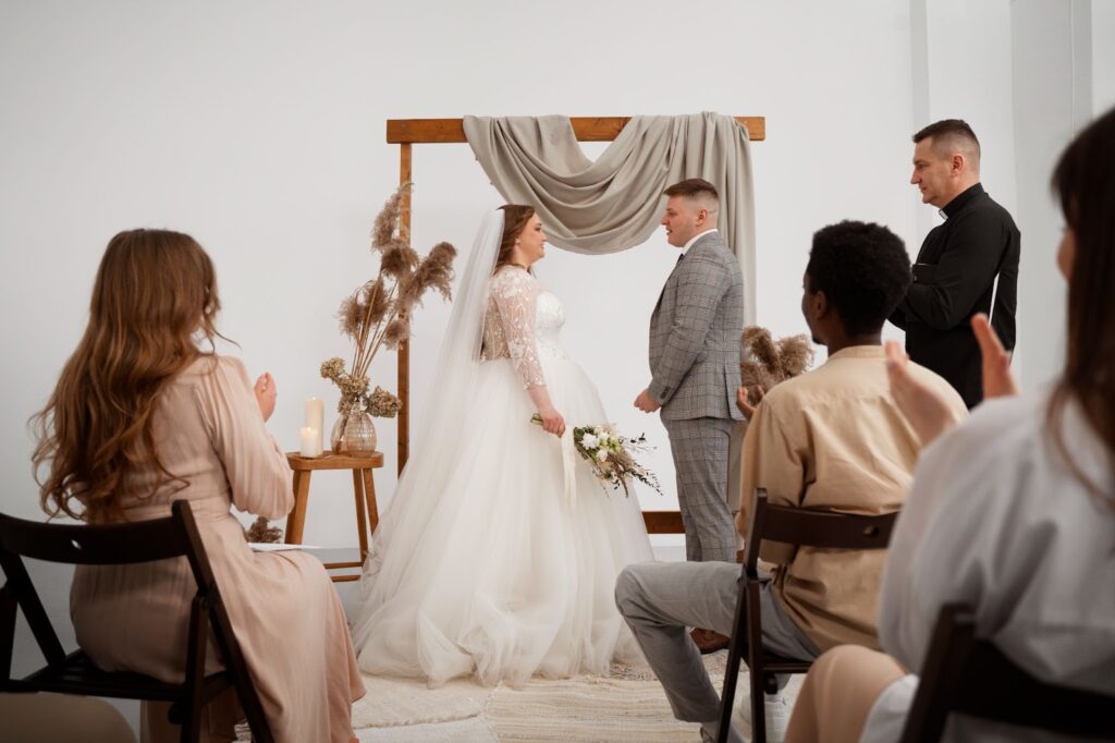 Bride and groom exchanging vows at the wedding ceremony